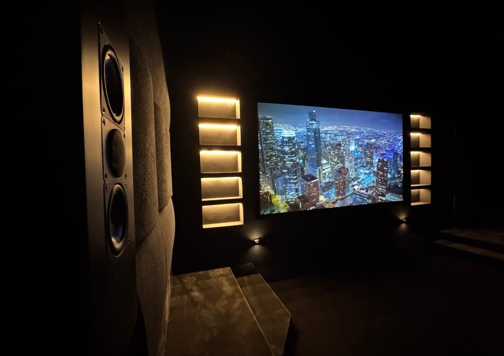 Dedicated home theatre in Dubai with projector screen and surround sound