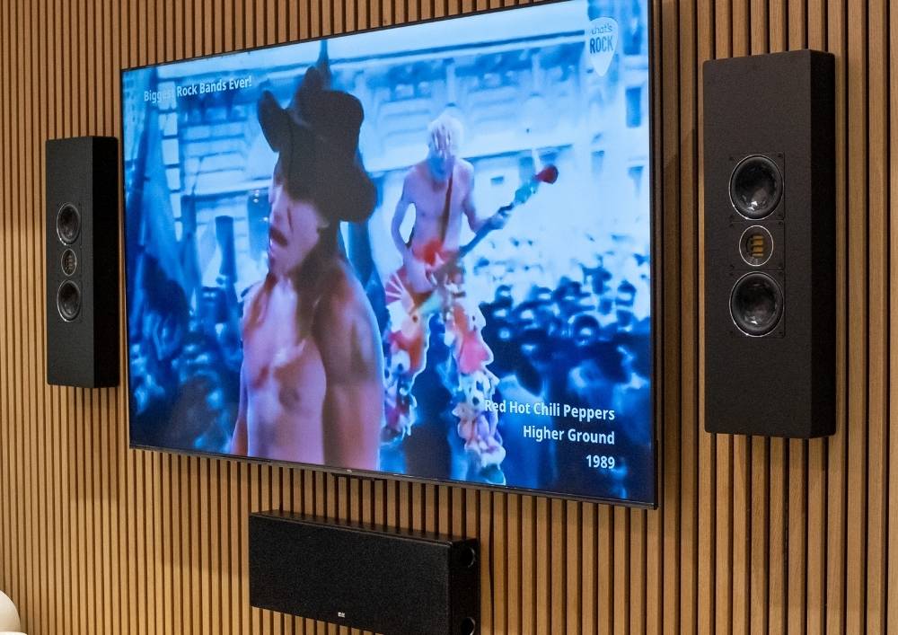 Media room with backlit feature wall and integrated speakers in Dubai